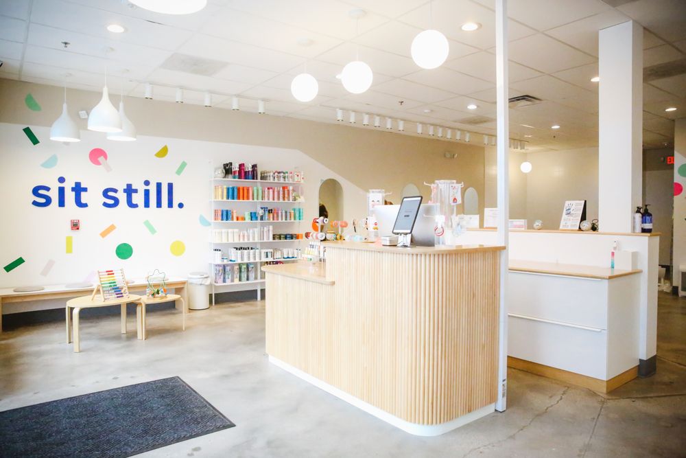 Sit Still Kids Flower Mound Logo