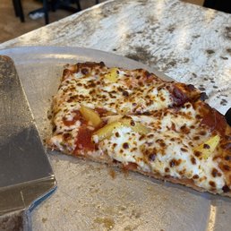 Pepperoni and pineapple pizza