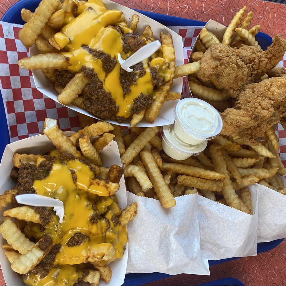 Two orders of chili cheese fries and chicken tender meal. Two orders of chili cheese fries and chicken tender meal.