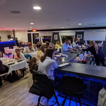 Bernini Pizzeria and Wine Bar - people sitting at tables - Italian Near Me - Laconia, New Hampshire Bernini Pizzeria and Wine Bar - people sitting at tables - Italian Near Me - Laconia, New Hampshire