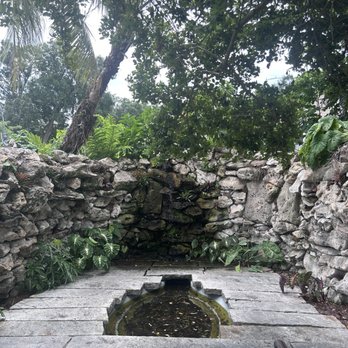 Hollis Garden - Covered rocky nook with a waterfall - Botanical Gardens Near Me - Lakeland, Florida