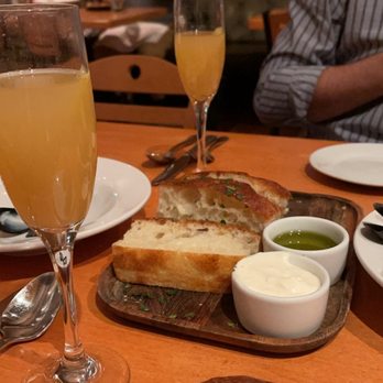 Trio American Bistro - a plate of food and a glass of orange juice - New American Near Me - Jackson, Wyoming Trio American Bistro - a plate of food and a glass of orange juice - New American Near Me - Jackson, Wyoming