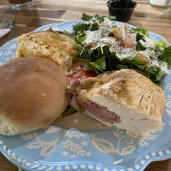 Shayne’s Cafe - Stuffed chicken breast with ham/cheese, airy yeast roll garden salad creamy jalepeño dressing & decadent potatoes au gratin.