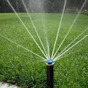 Irrigation Doctor - a sprinkler spraying water on a lawn - Landscaping Near Me - Calgary, Alberta