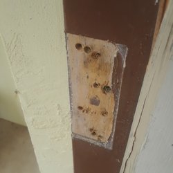 Jetson TV & Appliance - Damaged hinges with extra holes that compromise the integrity of our home.