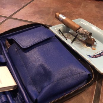 Churchill Smoke Shoppe - a blue leather case with a cigar on it - Tobacco Shops Near Me - Jackson, Mississippi Churchill Smoke Shoppe - a blue leather case with a cigar on it - Tobacco Shops Near Me - Jackson, Mississippi