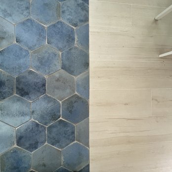 Divinity Flooring Services - Very clean and beautiful transition of new tile from dining/nook to the kitchen. - Flooring Near Me