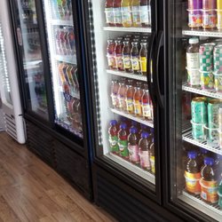 TG Deli - Multiple beverage coolers, all filled with options.