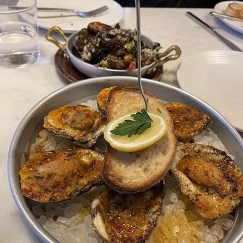 OLIVIA - Baked oysters and crispy brussel sprouts - Italian Near Me - Tampa, Florida OLIVIA - Baked oysters and crispy brussel sprouts - Italian Near Me - Tampa, Florida