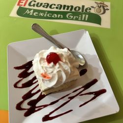 El Guacamole - Delicious tres leches cake with blueberry sauce