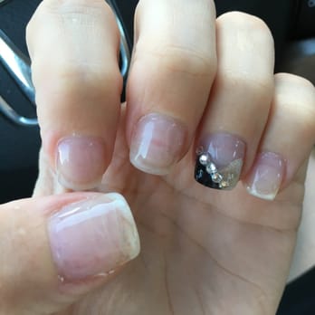 Sweet Nails and Spa - Sloppy fill; notice lumpiness in paint, silver is not a clean edge at cuticle, black doesn't cleanly go to edge of nail tip. - Nail Salons Near Me - Austin, Texas Sweet Nails and Spa - Sloppy fill; notice lumpiness in paint, silver is not a clean edge at cuticle, black doesn't cleanly go to edge of nail tip. - Nail Salons Near Me - Austin, Texas