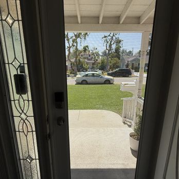 Den Defenders Security Doors - View out from inside with front door open, security screen closed and secure. - Door Sales/Installation Near Me