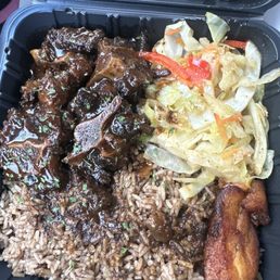 Oxtail with rice and peas / cabbage / plantain Oxtail with rice and peas / cabbage / plantain