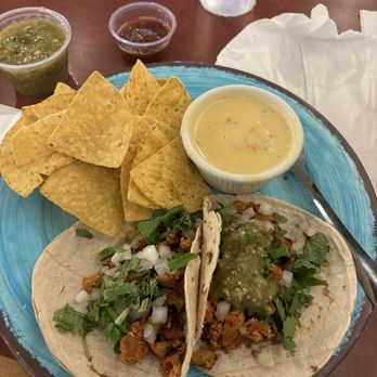 Roosters - Al Pastor Pork tacos with a side of chips and Queso Blanco - Tacos Near Me - Mobile, Alabama