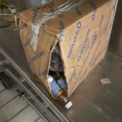 FedEx Ground - A customer package a package handler has unloaded from a semi and let go down the conveyor belt.