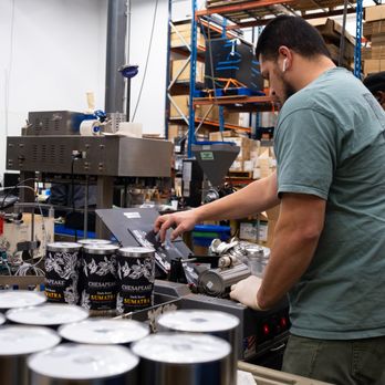 Chesapeake Coffee Roasters - a man working in a factory - Coffee Roasteries Near Me - Crofton, Maryland Chesapeake Coffee Roasters - a man working in a factory - Coffee Roasteries Near Me - Crofton, Maryland