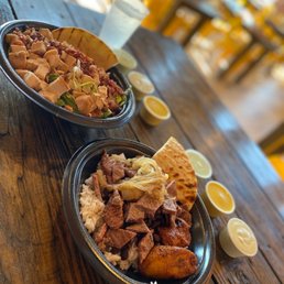 two bowls of food on a wooden table two bowls of food on a wooden table