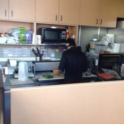 Three Rivers Espresso and Cafe - Dude doing work when not on the phone, dropping cutting utensils on the floor and then picking them up to use them on a sandwich