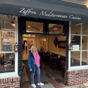 Zaffron Mediterranean Cuisine - a woman standing in front of a restaurant - Mediterranean Near Me - Haddonfield, New Jersey
