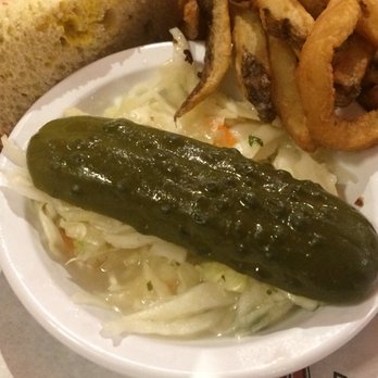 Dunn's - Closeup of pickle and coleslaw - Poutineries Near Me - Montreal, Quebec Dunn's - Closeup of pickle and coleslaw - Poutineries Near Me - Montreal, Quebec