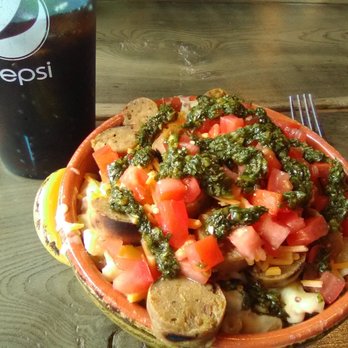 Bangers & Brews Eugene - Mac and cheese with a smoked apple veggie sausage, diced tomatoes, shredded cheddar cheese, and chimichurri sauce. - German Near Me - Eugene, Oregon