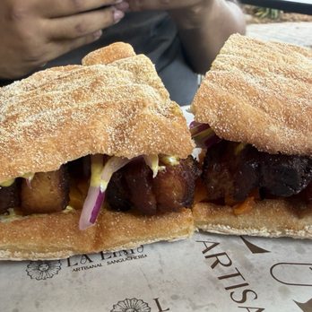 La Lima Sangucheria - The Chicharron with pickled onions, sweet potato and the amazing mustard sauce - Sandwiches Near Me - Charlotte, North Carolina La Lima Sangucheria - The Chicharron with pickled onions, sweet potato and the amazing mustard sauce - Sandwiches Near Me - Charlotte, North Carolina