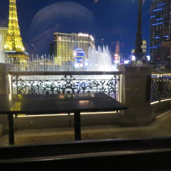 Yellowtail Japanese Restaurant & Lounge - The view from my table.  There were some tourists eating on the patio with the heaters going. - Japanese Near Me - Las Vegas, Nevada