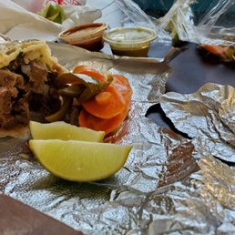 a burrito with a slice of lime a burrito with a slice of lime