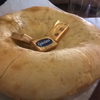 Nargis Cafe - "Non" - Uzbek Style Round Bread 3.00 (1st one is complimentary; otherwise $3.00) - Middle Eastern Near Me - Brooklyn, New York Nargis Cafe - "Non" - Uzbek Style Round Bread 3.00 (1st one is complimentary; otherwise $3.00) - Middle Eastern Near Me - Brooklyn, New York