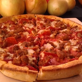 Massey's Pizza - a whole pizza on a cutting board - Pizza Near Me - Pataskala, Ohio