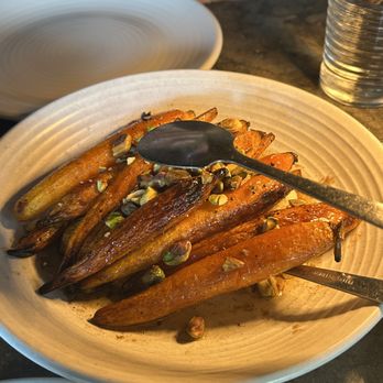 Red Ash - WOOD ROASTED BABY CARROTS
smoked pistachios / citrus / honey / herb ricotta / - Italian Near Me - Austin, Texas Red Ash - WOOD ROASTED BABY CARROTS
smoked pistachios / citrus / honey / herb ricotta / - Italian Near Me - Austin, Texas
