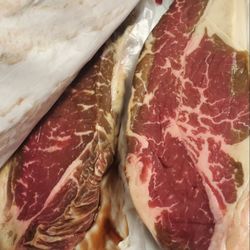 Purdy's Quality Meats - This is the NY strips 2 of the 4 we had gotten he said he was going to cook them tonight because thisbis not bad lmao