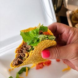 Casa Maria - * A crispy corn taco shell * Seasoned ground beef * Shredded cheddar cheese * Chopped lettuce * Diced fresh tomatoes
