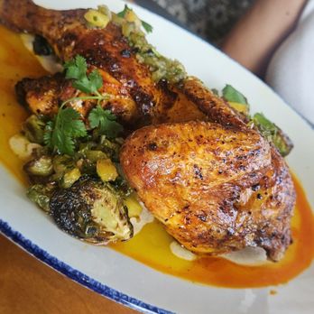 McArthur's - Sonoran Half chicken, Sonoran yogurt sauce jalapeño chimichurri, charred Brussels sprouts, pineapple chutney - Breakfast & Brunch Near Me - Phoenix, Arizona