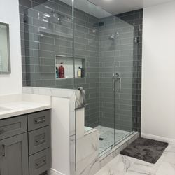 Blizzard Frameless Shower Doors - 90° enclosure with a double seat notch with low iron glass