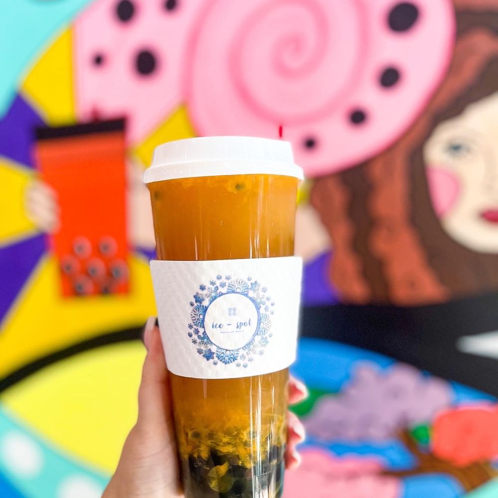 Ice Spot - a hand holding a cup of iced tea - Bubble Tea Near Me - Lake Mary, Florida Ice Spot - a hand holding a cup of iced tea - Bubble Tea Near Me - Lake Mary, Florida