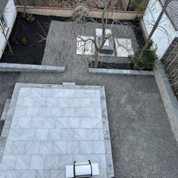 We purposely left the back wall unfinished.  We also have not put out our furniture/finish the plants because the weather isn't there yet.