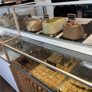 SumSum - Some of their halvas ----top shelf. Baklavas---bottom shelf. They have more halva flavors on other displays... - Desserts Near Me - Honolulu, Hawaii SumSum - Some of their halvas ----top shelf. Baklavas---bottom shelf. They have more halva flavors on other displays... - Desserts Near Me - Honolulu, Hawaii