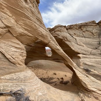 Dreamland Safari Tours - Melody arch, alcove located above the Wave, with window view of TeePees - Tours Near Me - Kanab, Utah Dreamland Safari Tours - Melody arch, alcove located above the Wave, with window view of TeePees - Tours Near Me - Kanab, Utah