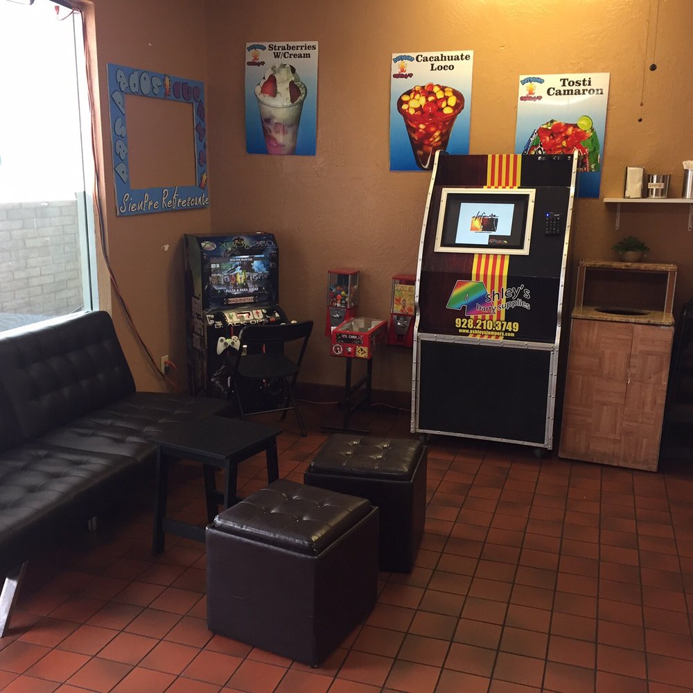Raspados Cuchy's - a living room with a couch, coffee table, and arcade machine - Shaved Ice Near Me - Yuma, Arizona Raspados Cuchy's - a living room with a couch, coffee table, and arcade machine - Shaved Ice Near Me - Yuma, Arizona
