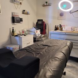 Norse Skin Care - Treatment room with Kristyn. Laser Hair removal, tattoo removal machines are located in this room but mobile within the salon.
