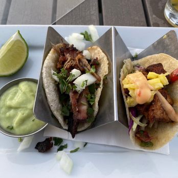 Lighthouse - On the left: Carnitas tacos On the right: Fish tacos al pastor In the background: Mai tai - Breakfast & Brunch Near Me - Newport Beach, California Lighthouse - On the left: Carnitas tacos On the right: Fish tacos al pastor In the background: Mai tai - Breakfast & Brunch Near Me - Newport Beach, California