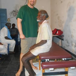 Helping Hands Chiropratic - Dr. Williams treating the poor in India.