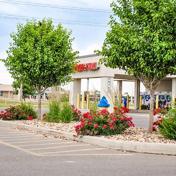 GAS Lawn Pros - a gas station with trees and flowers - Lawn Services Near Me - Liberal, Kansas