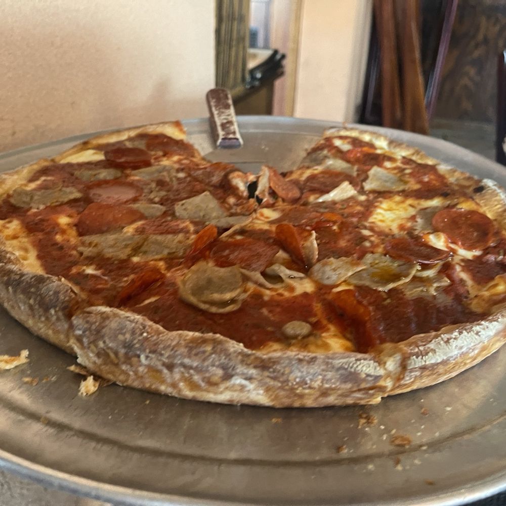Deep dish pizza with pepperoni and sausage Deep dish pizza with pepperoni and sausage