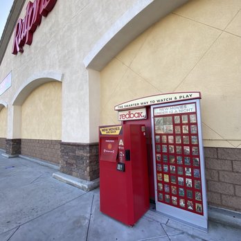 Ralphs - a red vending machine and a red phone booth - Grocery Near Me - Riverside, California