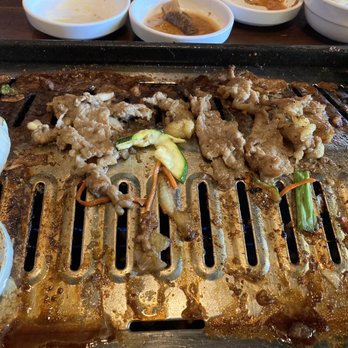 Dae Gee Korean Bbq - Barbecuing the meat - Korean Near Me - Aurora, Colorado