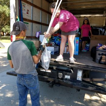 Belle's Superior Movers - Owner/manager Lea Ann with Belle's Superior Movers and Anna"BELLE" passing out supplies in Beaumont Tx after HURRICANE HARVEY. - Movers Near Me - Leander, Texas Belle's Superior Movers - Owner/manager Lea Ann with Belle's Superior Movers and Anna"BELLE" passing out supplies in Beaumont Tx after HURRICANE HARVEY. - Movers Near Me - Leander, Texas