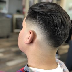 Cutting Edge Barbershop - Skin dropped fade with sleek back.
