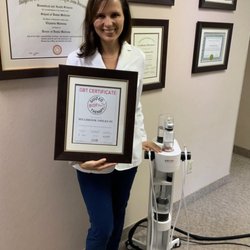 Reina P Garcia, DMD - Dr. Malinina with new EMS machine